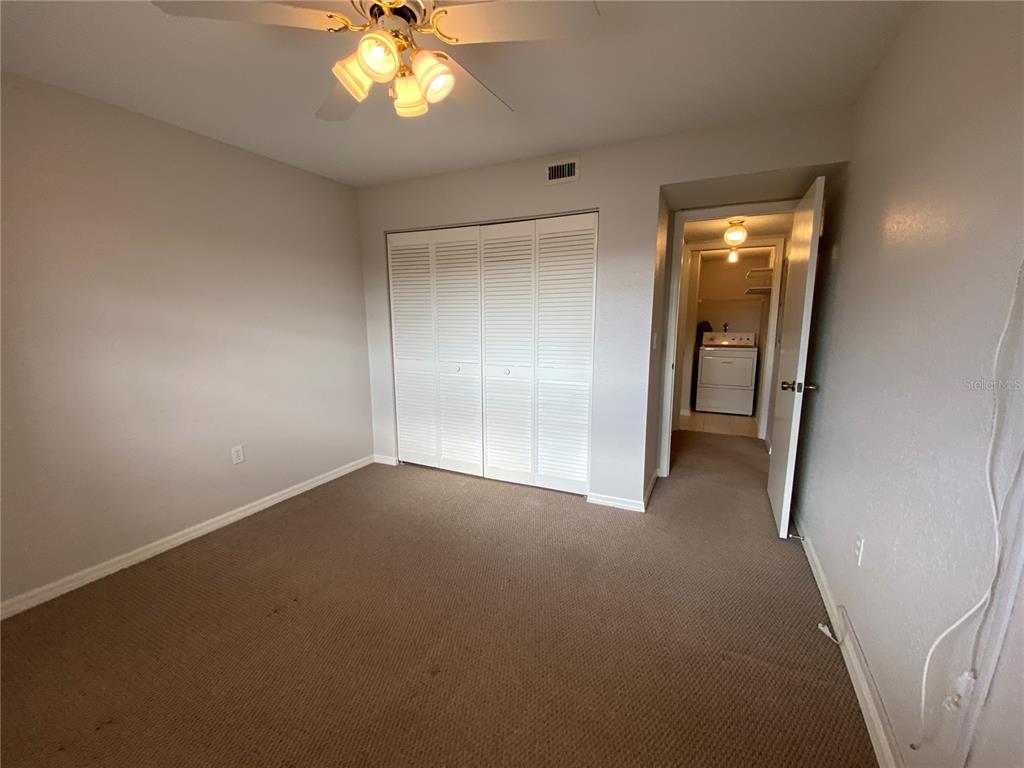 1360 Rio De Janeiro Avenue, Unit 108 Punta Gorda, FL 33983 - Photo 16 of 18 a view of an empty room with a window