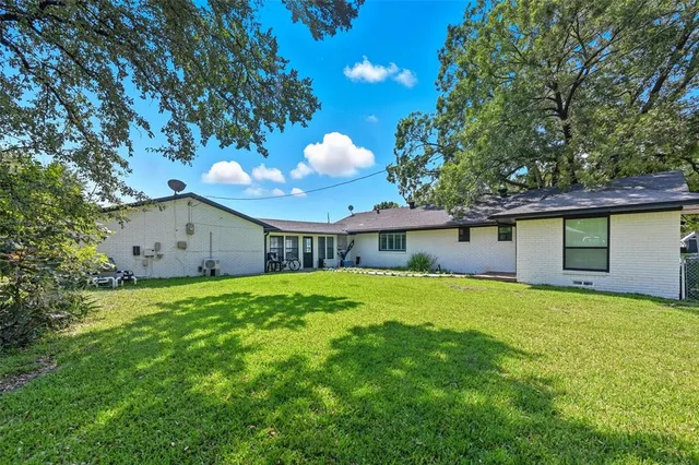 a house with garden in front of it