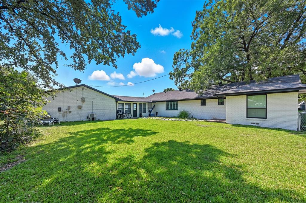 5100 Murphy Road Sachse, TX 75048 - Photo 17 of 38 a view of a backyard with a garden and plants