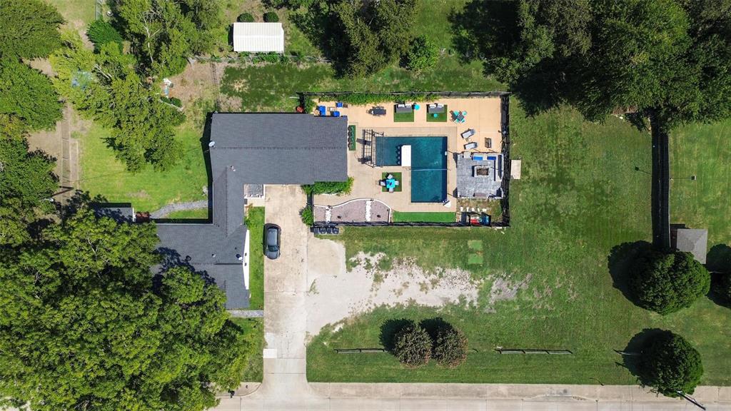 5100 Murphy Road Sachse, TX 75048 - Photo 25 of 38 an aerial view of a house with a yard basket ball court and outdoor seating