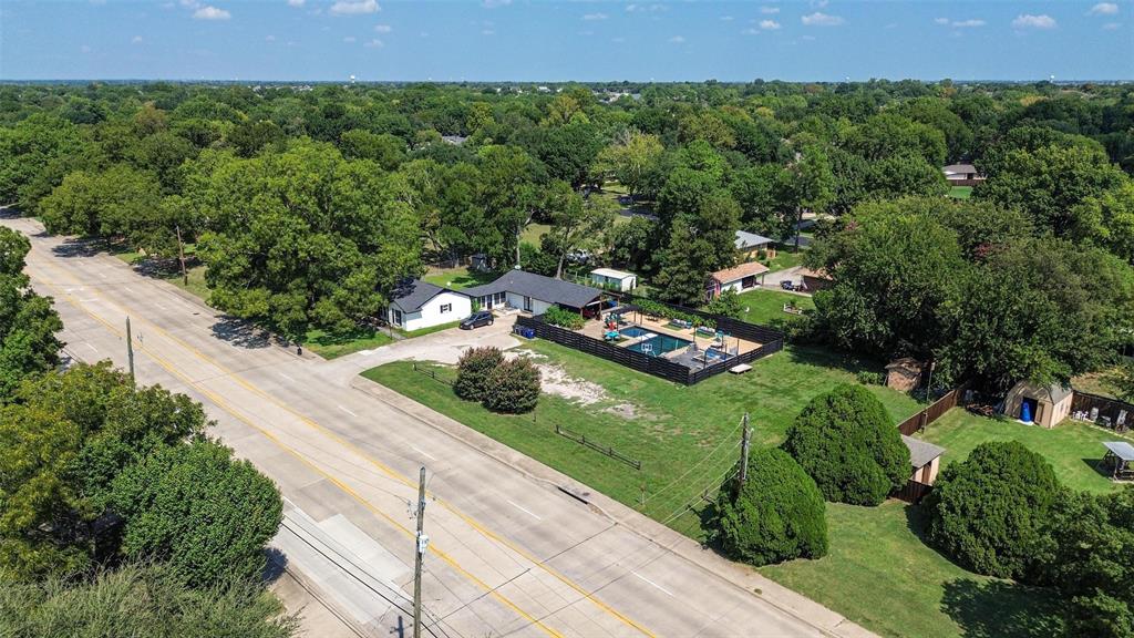 5100 Murphy Road Sachse, TX 75048 - Photo 26 of 38 an aerial view of a house with a yard