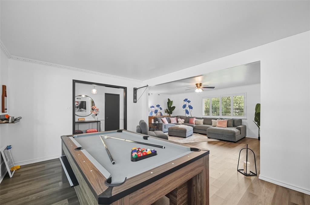 5100 Murphy Road Sachse, TX 75048 - Photo 3 of 38 a living room with furniture and a wooden floor
