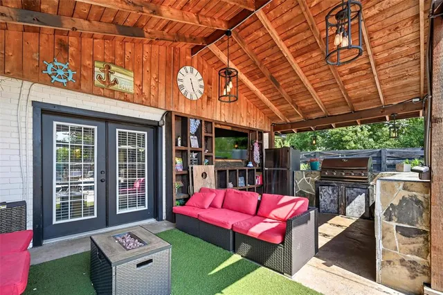 an aerial view of a house having patio with a yard