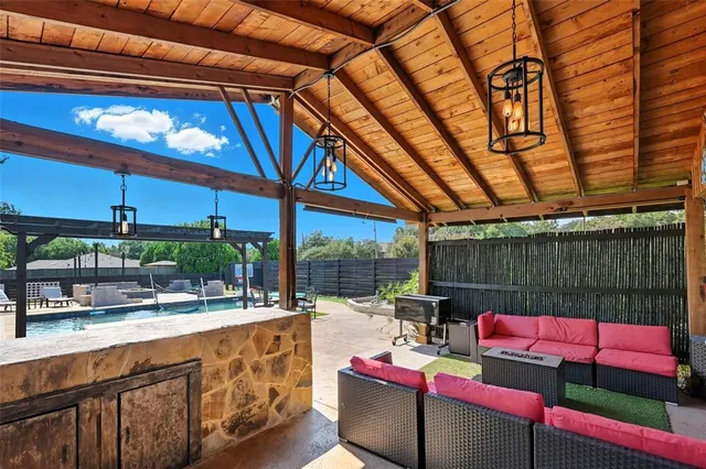 swimming pool view with a seating space