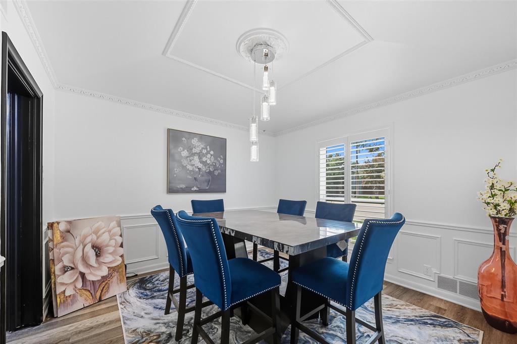 5100 Murphy Road Sachse, TX 75048 - Photo 4 of 38 a view of a dining room with furniture window and wooden floor