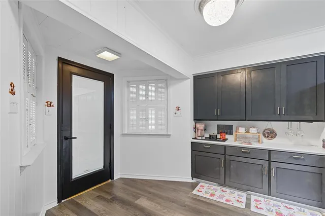 a kitchen with cabinets and window