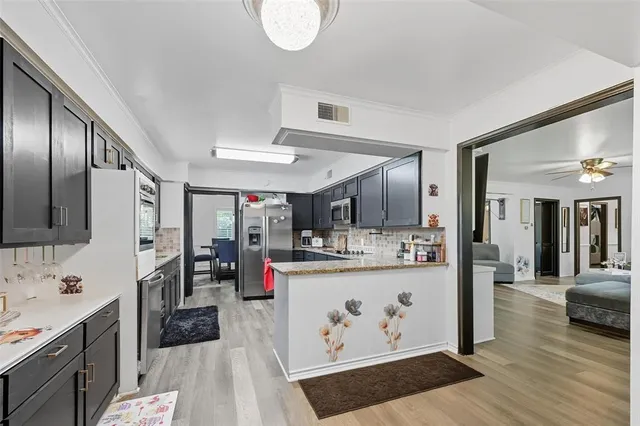 a view of a park with potted plants