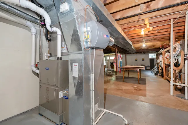 a room with lots of white furniture and shower