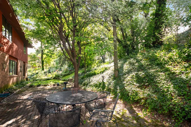 a view of a backyard with sitting area