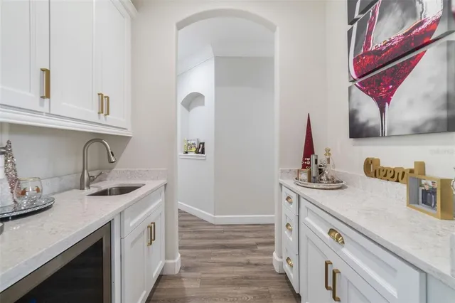 a kitchen with sink and cabinets