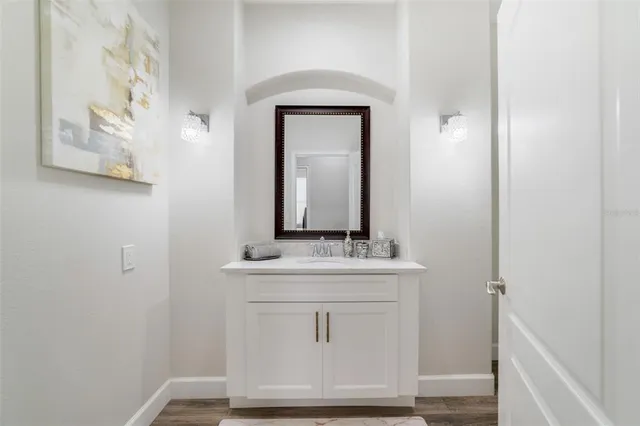 a bathroom with a sink and a mirror