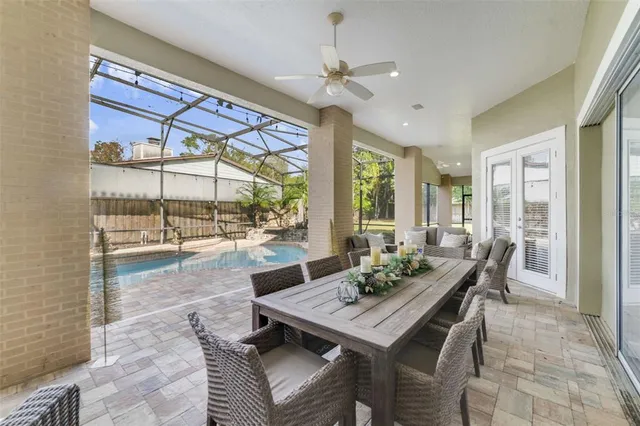a view of a dining room with furniture wooden floor and a chandelier
