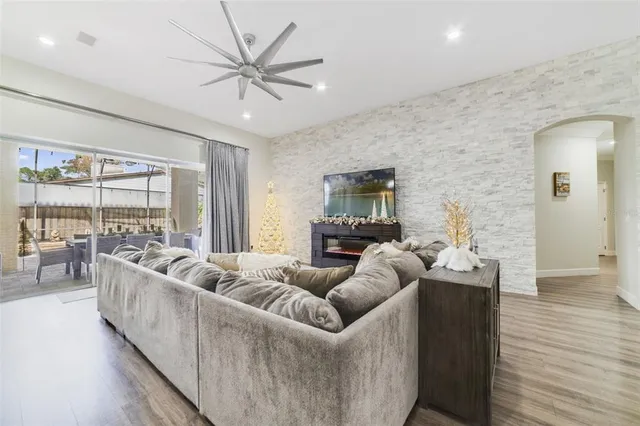 a living room with furniture and a large window