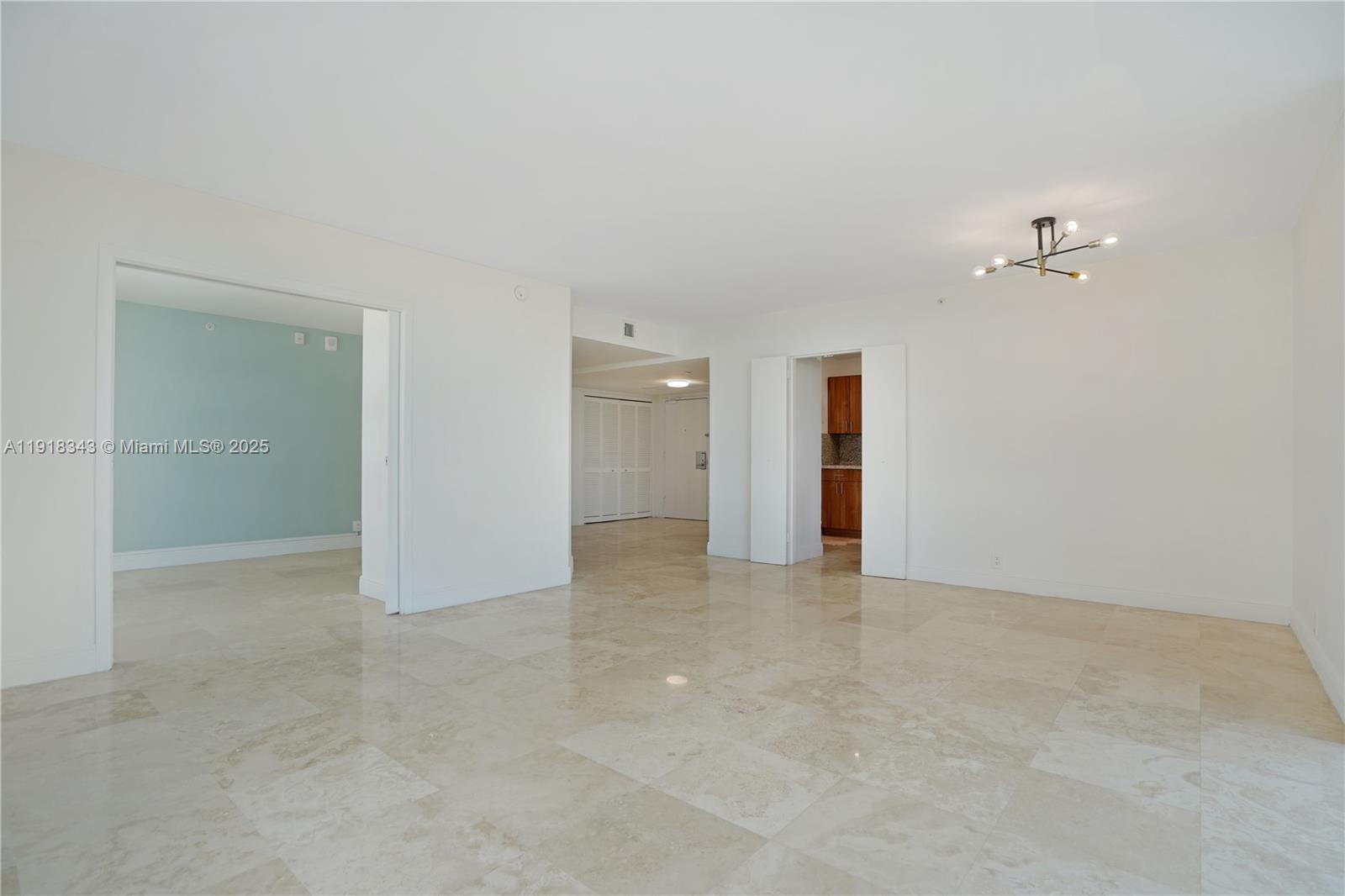 5101 Collins Avenue, Unit 14K Miami Beach, FL 33140 - Photo 12 of 13 an empty room with an entryway and shower