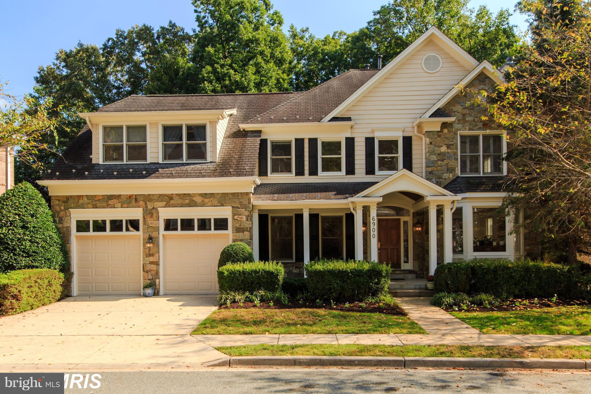 6900 Rannoch Road Bethesda, MD 20817 - Photo 1 of 22 a front view of a house with a yard