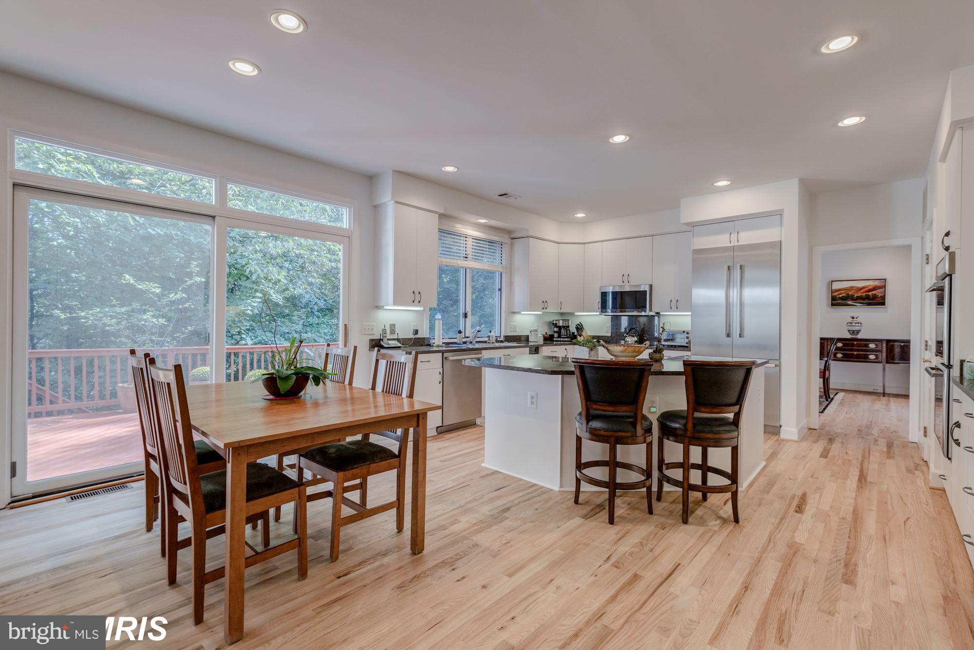 6900 Rannoch Road Bethesda, MD 20817 - Photo 12 of 22 a view of a dining room with furniture window and wooden floor