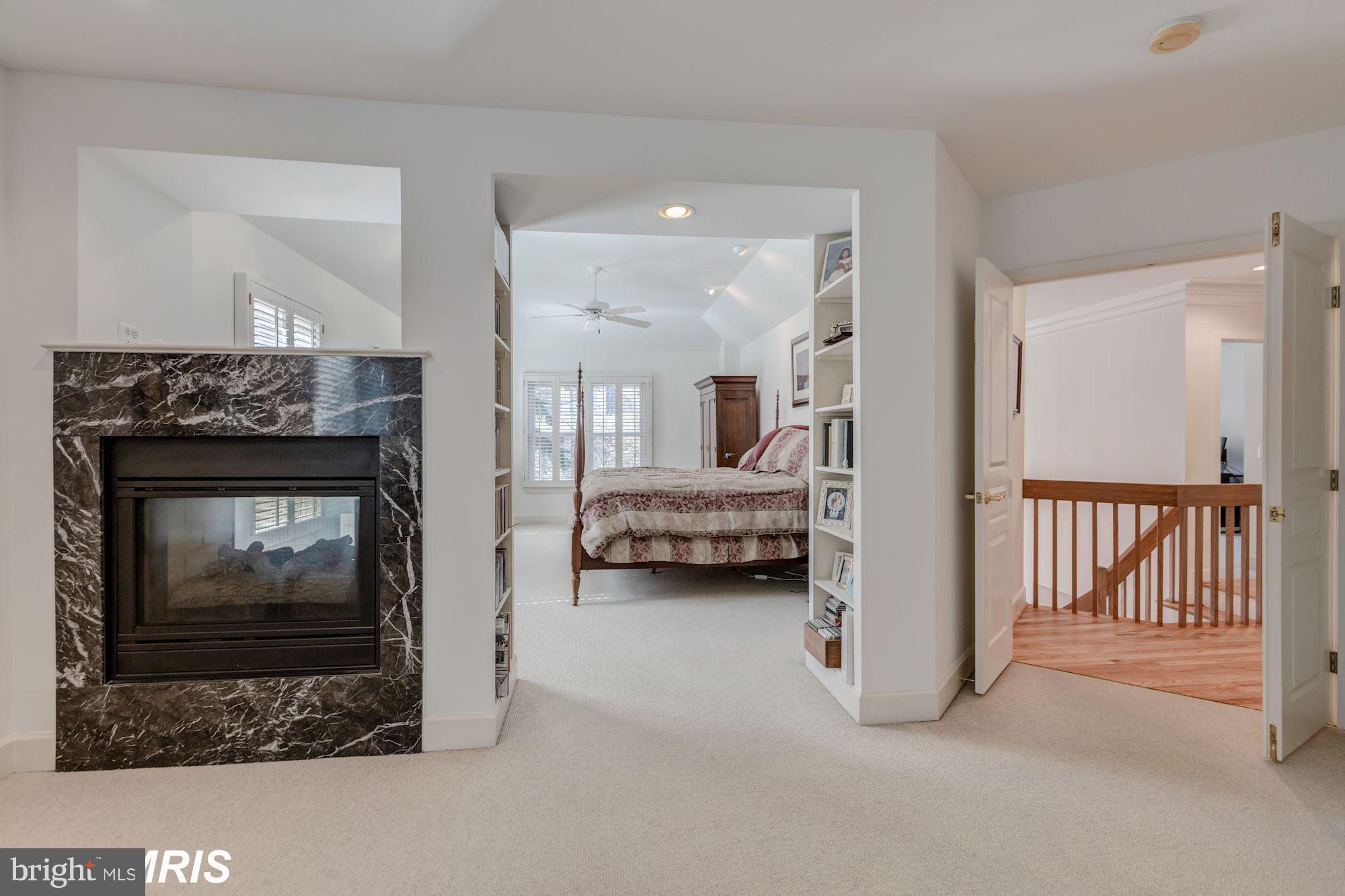 6900 Rannoch Road Bethesda, MD 20817 - Photo 18 of 22 a view of livingroom with furniture and a fireplace