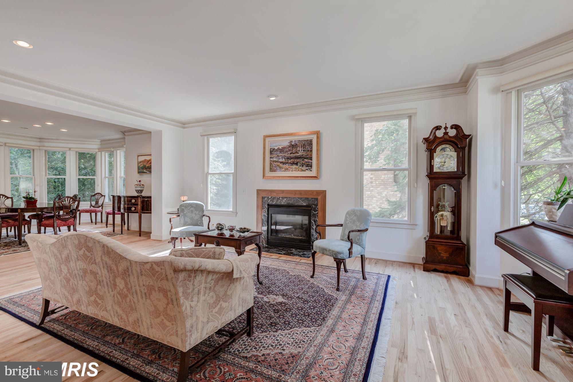 6900 Rannoch Road Bethesda, MD 20817 - Photo 3 of 22 a living room with furniture and a fireplace