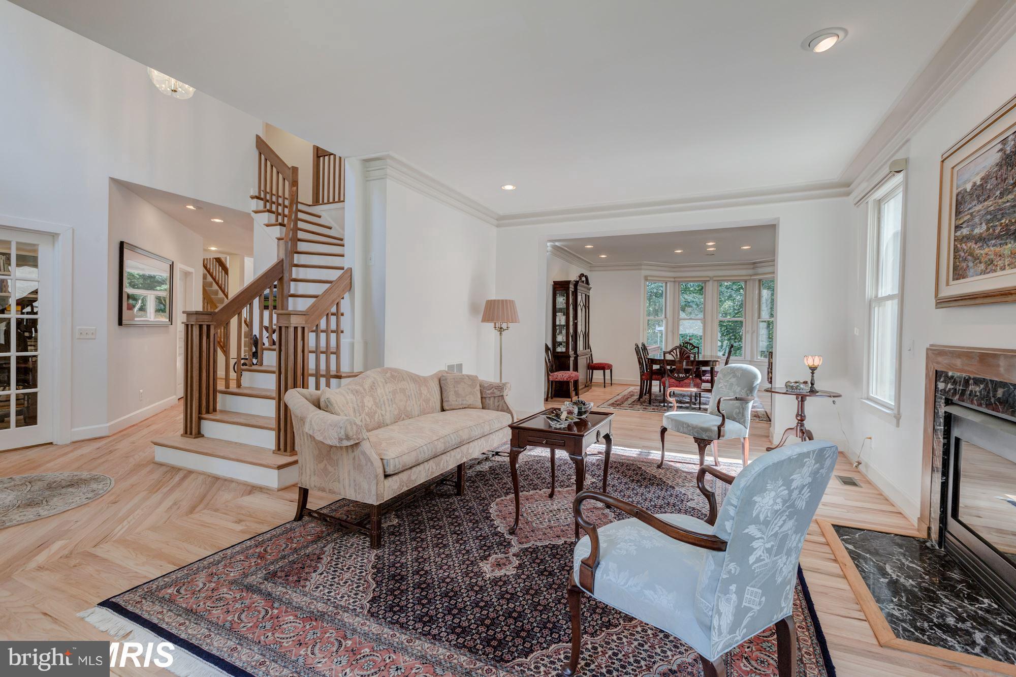 6900 Rannoch Road Bethesda, MD 20817 - Photo 4 of 22 a living room with furniture and a rug