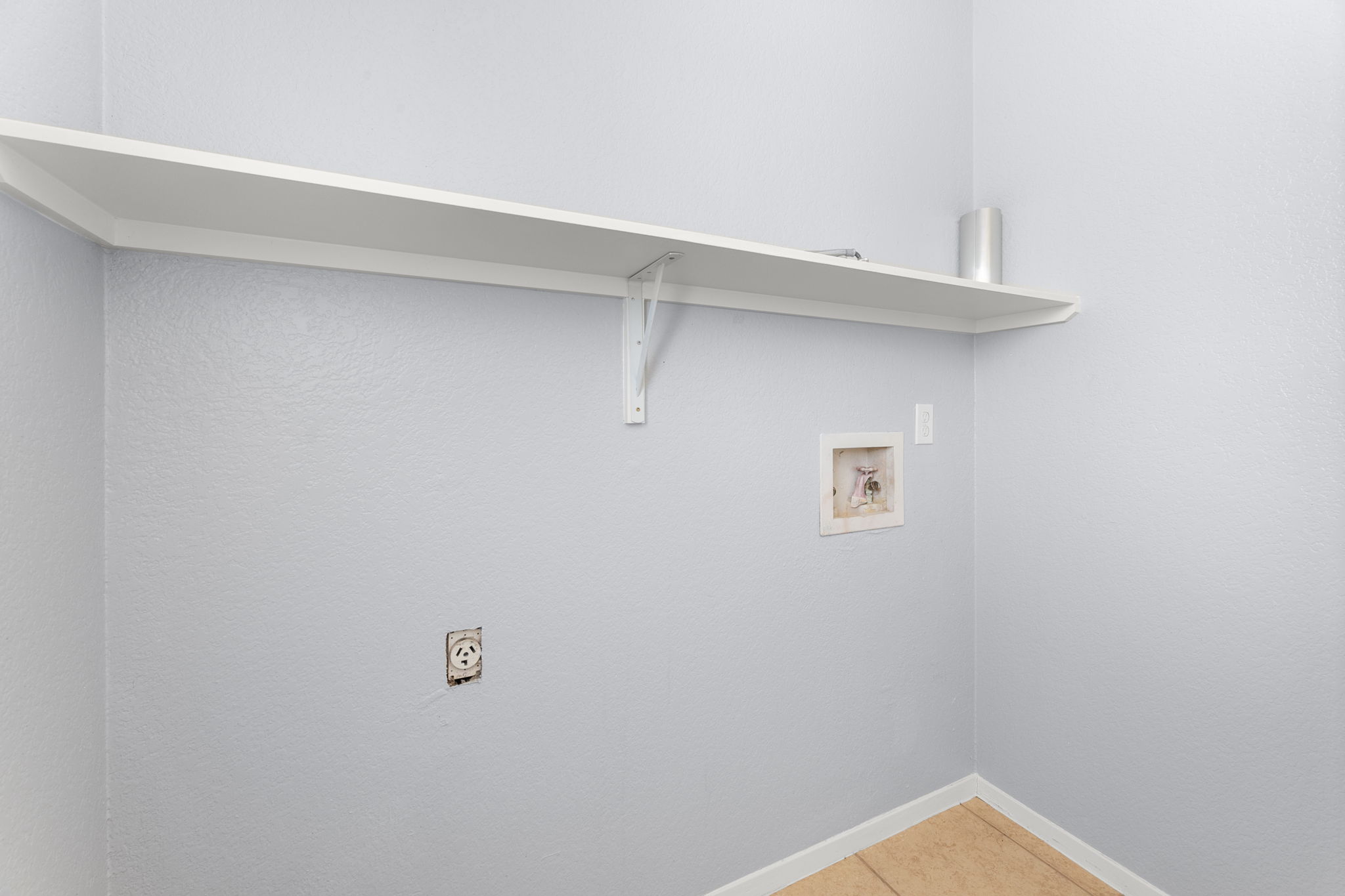 3802 Foust Trail, Unit A Georgetown, TX 78628 - Photo 14 of 34 Functional laundry space featuring a practical shelf for organization.