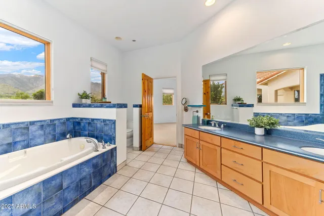 a view of a livingroom with wooden floor and chandelier