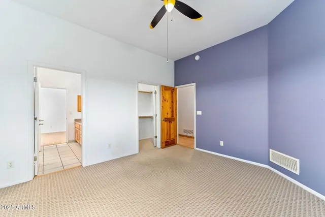 a bathroom with a granite countertop sink a bathtub and next to a window