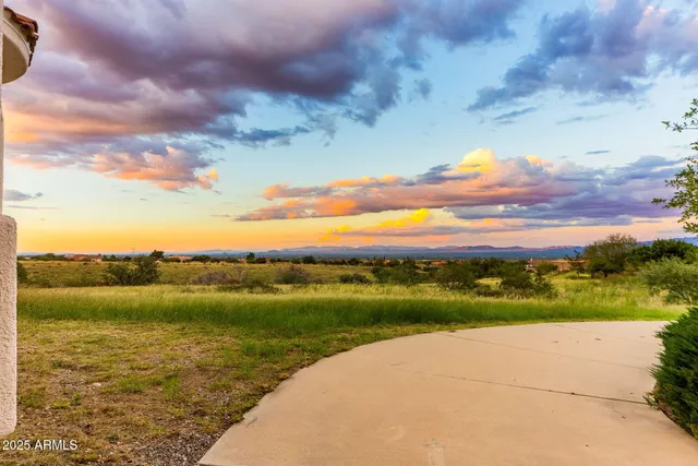 a large bathroom with a sink and mirror
