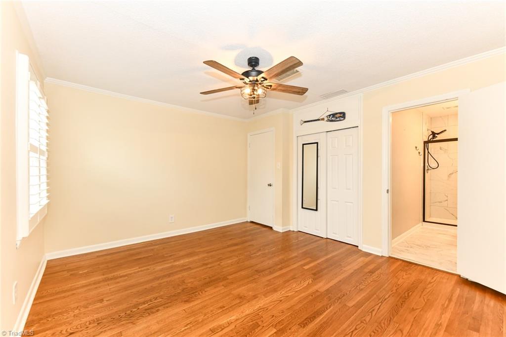 2010 Trosper Road Greensboro, NC 27455 - Photo 11 of 25 Primary main level bedroom