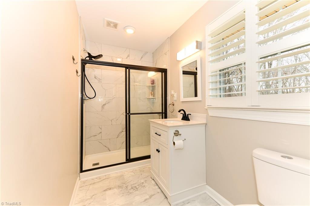 2010 Trosper Road Greensboro, NC 27455 - Photo 12 of 25 Primary main level bathroom