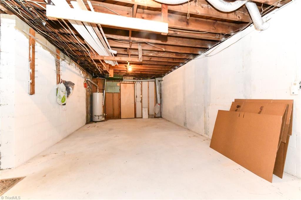 2010 Trosper Road Greensboro, NC 27455 - Photo 21 of 25 Walk in storage in the lower level