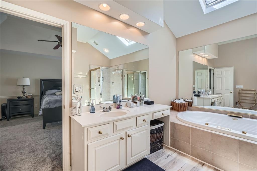 5106 Vining Estates Way Mableton, GA 30126 - Photo 14 of 28 a bathroom with a double vanity sink double vanity and mirror