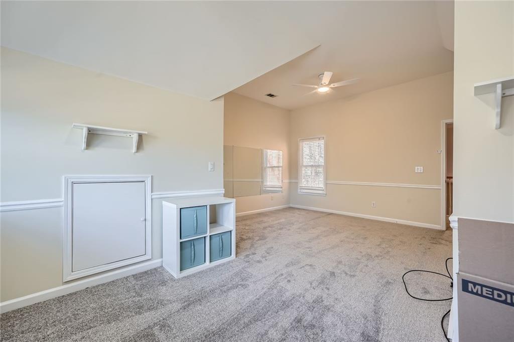 5106 Vining Estates Way Mableton, GA 30126 - Photo 15 of 28 an empty room with windows and cabinet