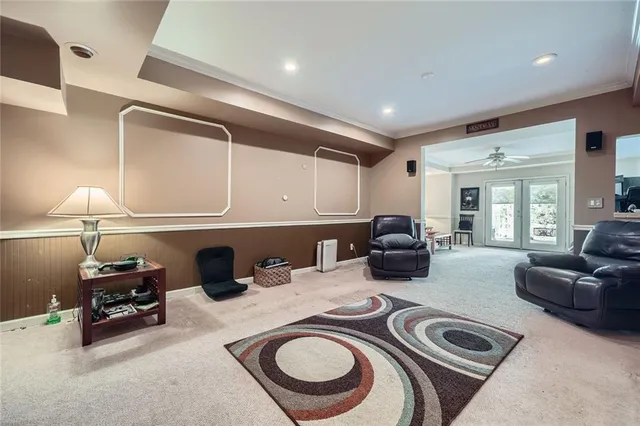 a living room with furniture a fireplace and a lamp