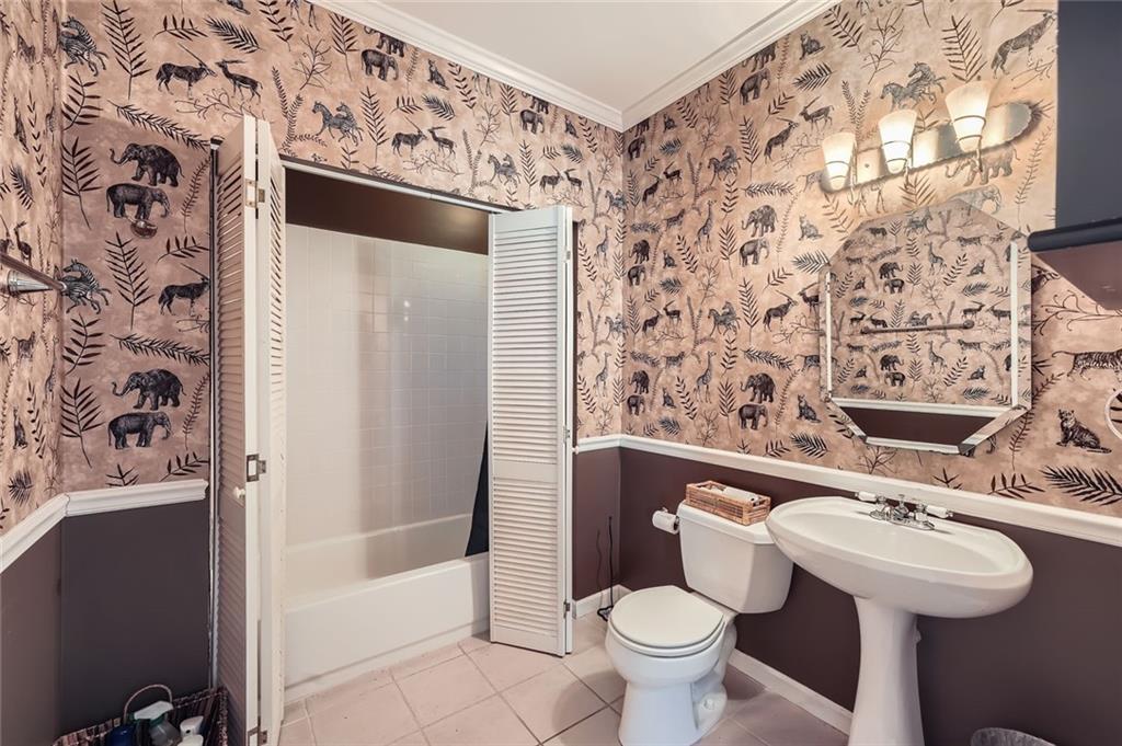 5106 Vining Estates Way Mableton, GA 30126 - Photo 24 of 28 a bathroom with a sink and mirror with toilet