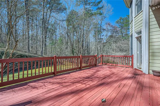 a view of backyard with a deck