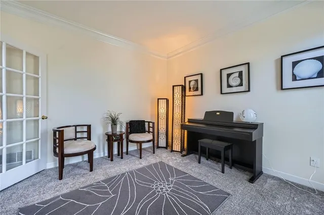 a view of a livingroom with furniture and piano table