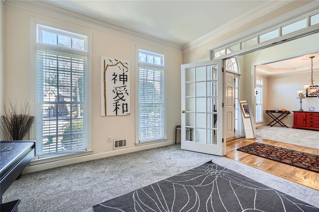 5106 Vining Estates Way Mableton, GA 30126 - Photo 8 of 28 a spacious bedroom with a bed and glass door