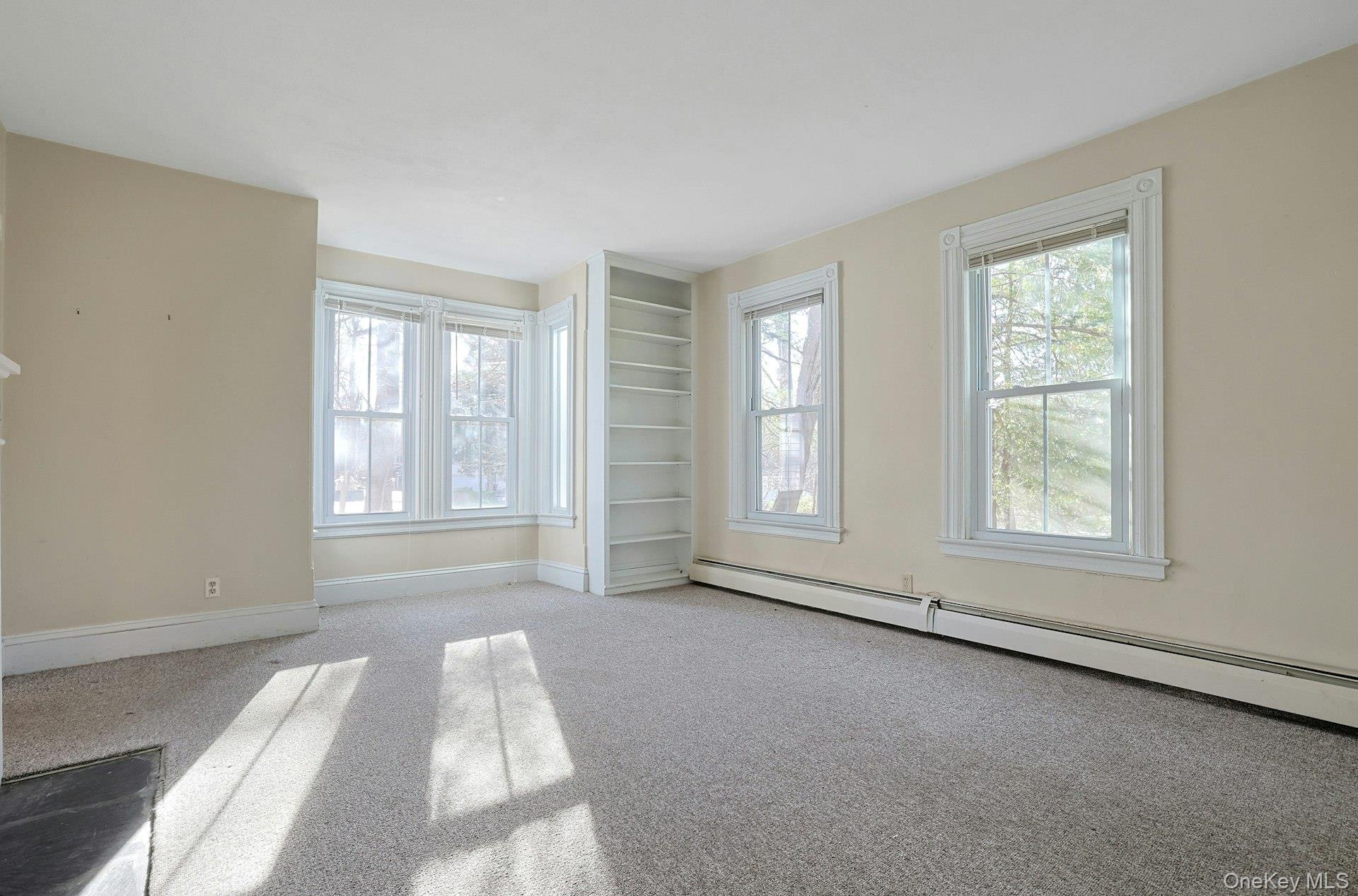 46 Mile Road Montebello, NY 10901 - Photo 11 of 25 Living room w built in shelves, large windows