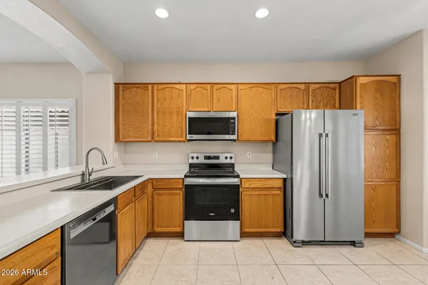 a bathroom with a double vanity sink and mirror