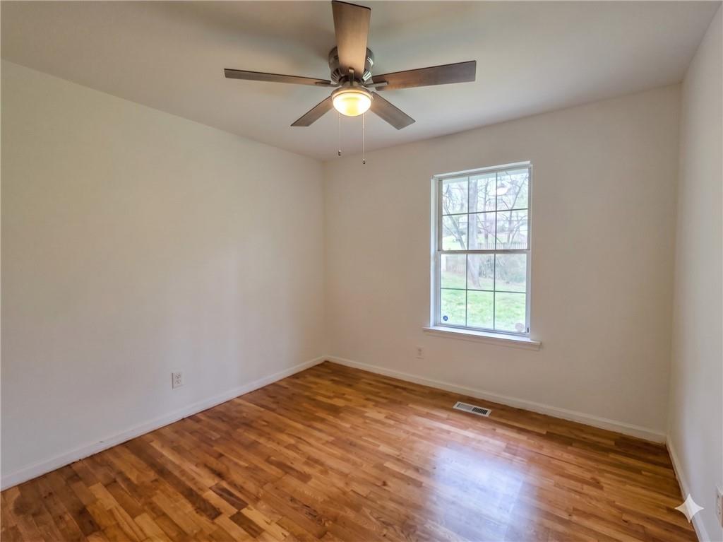 1929 Wee Kirk Road Southeast Atlanta, GA 30316 - Photo 11 of 22 an empty room with a window and a fan