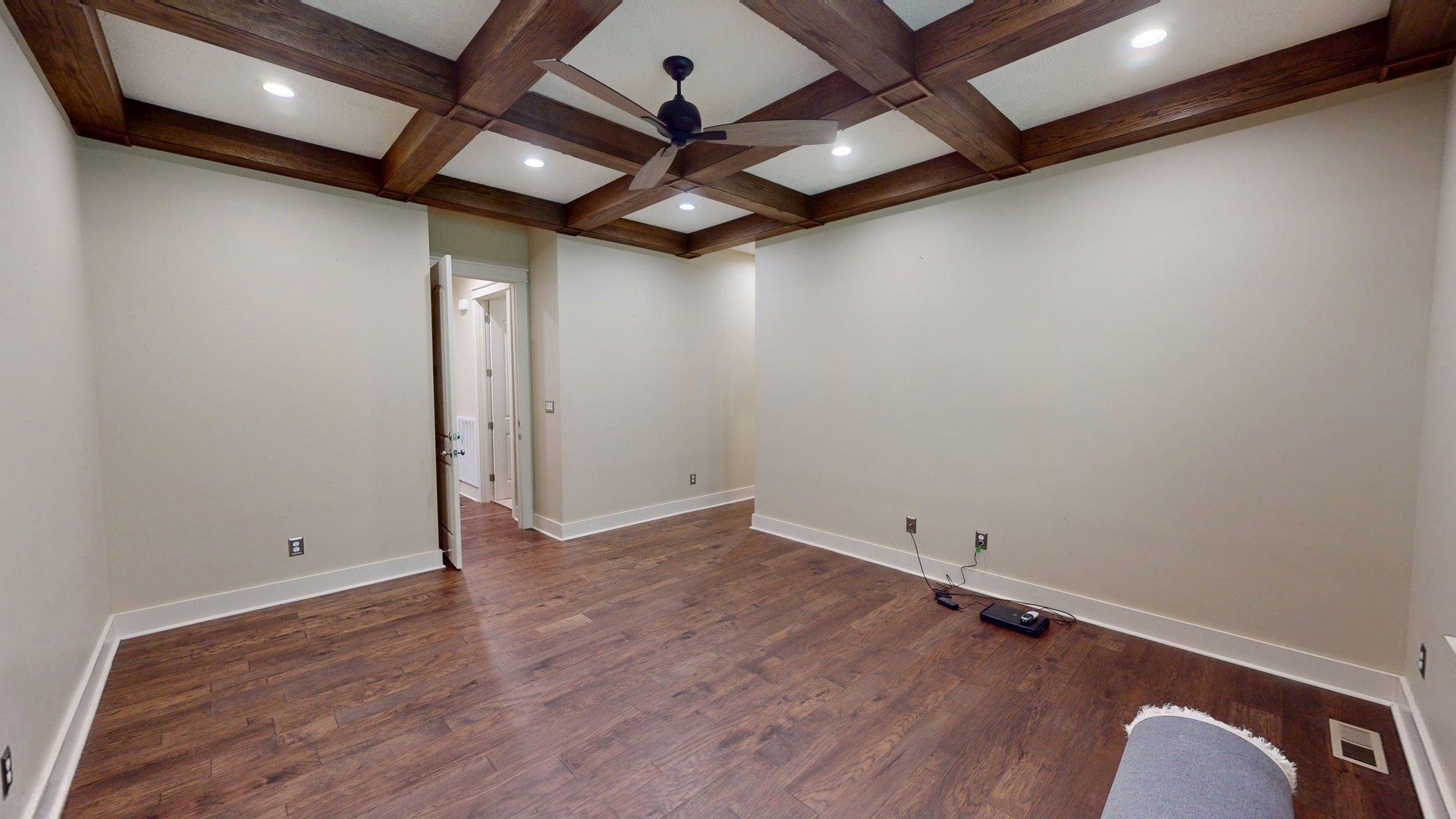 540 Breathtaking Loop Savannah, TN 38372 - Photo 11 of 40 an empty room with wooden floor and a ceiling fan