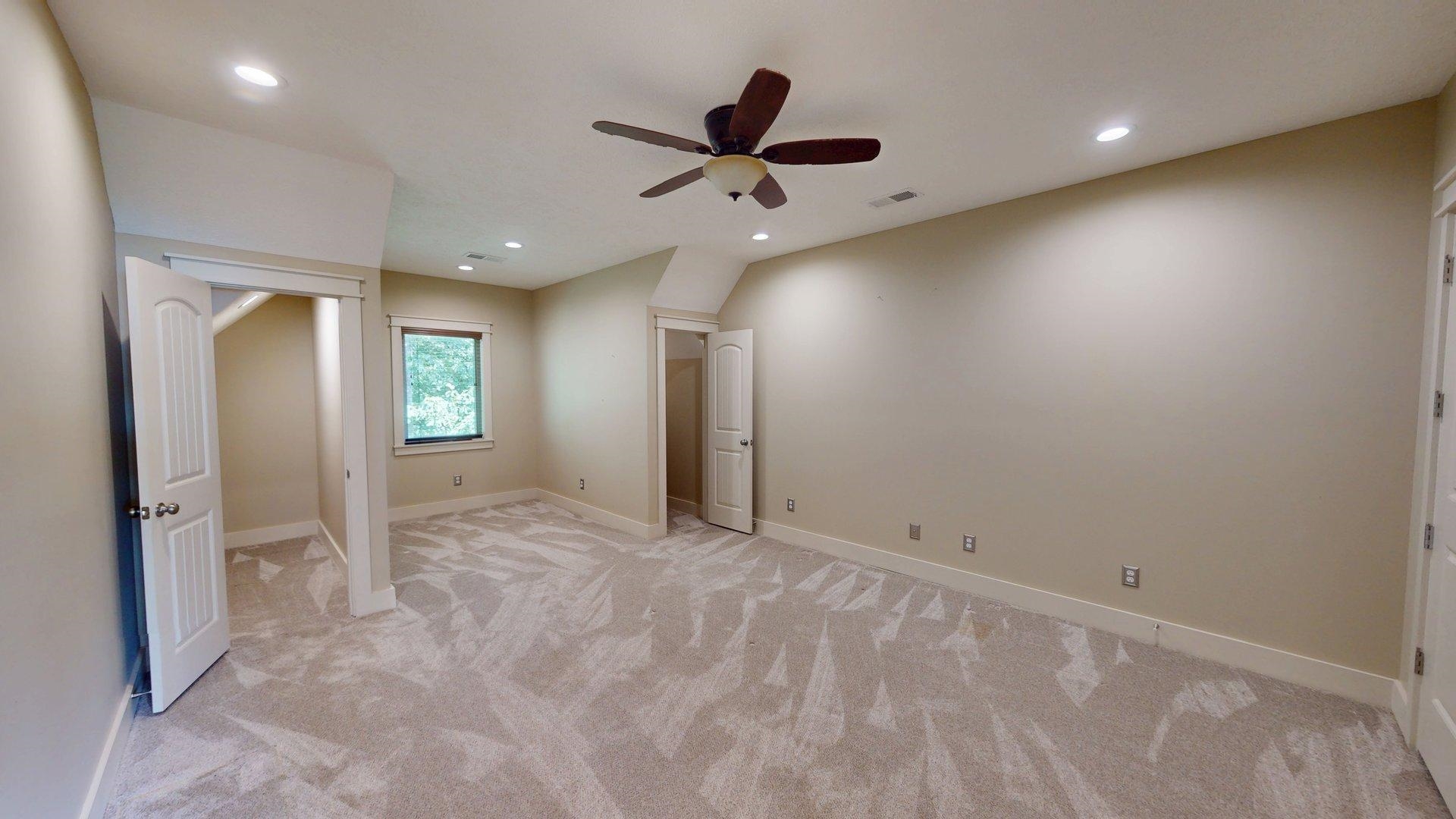 540 Breathtaking Loop Savannah, TN 38372 - Photo 15 of 40 an empty room with window and ceiling fan