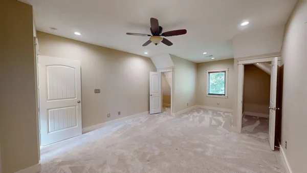 a bathroom with a granite countertop sink and mirror