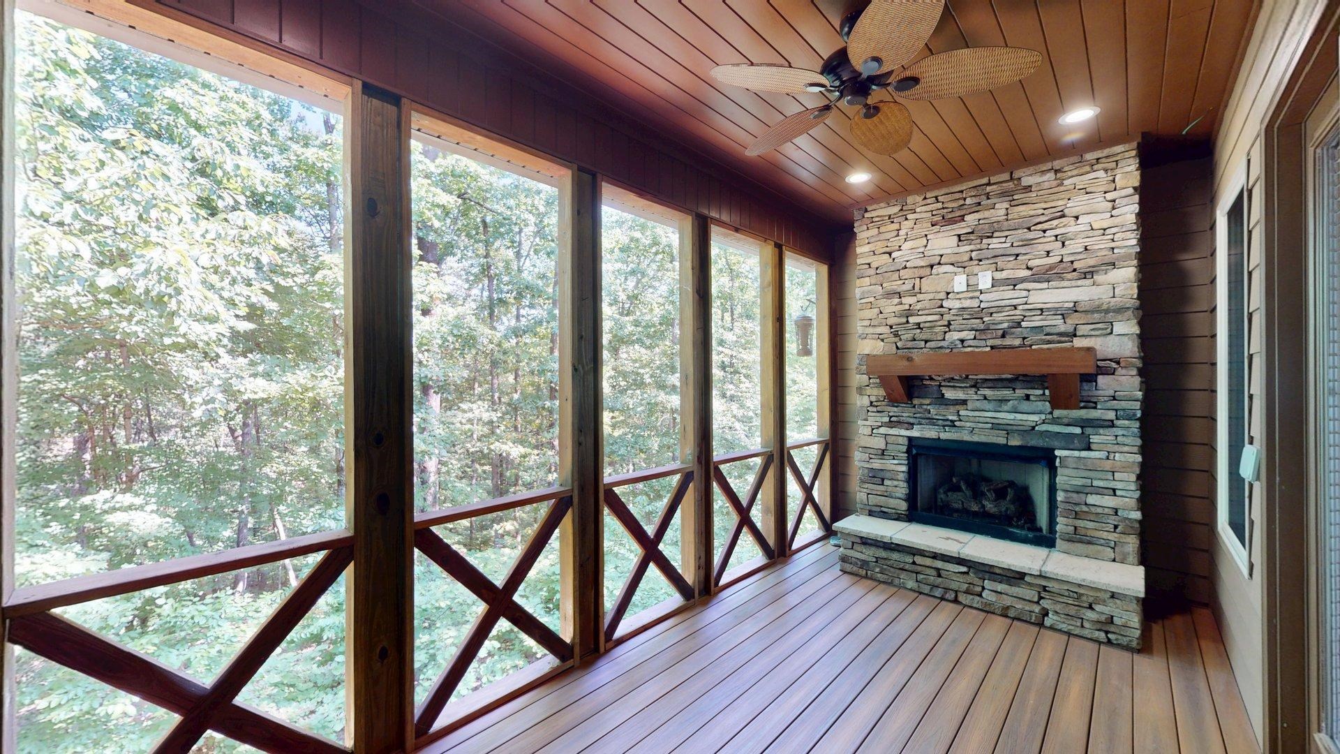 540 Breathtaking Loop Savannah, TN 38372 - Photo 29 of 40 a view of a room with wooden floor a ceiling fan and a fireplace