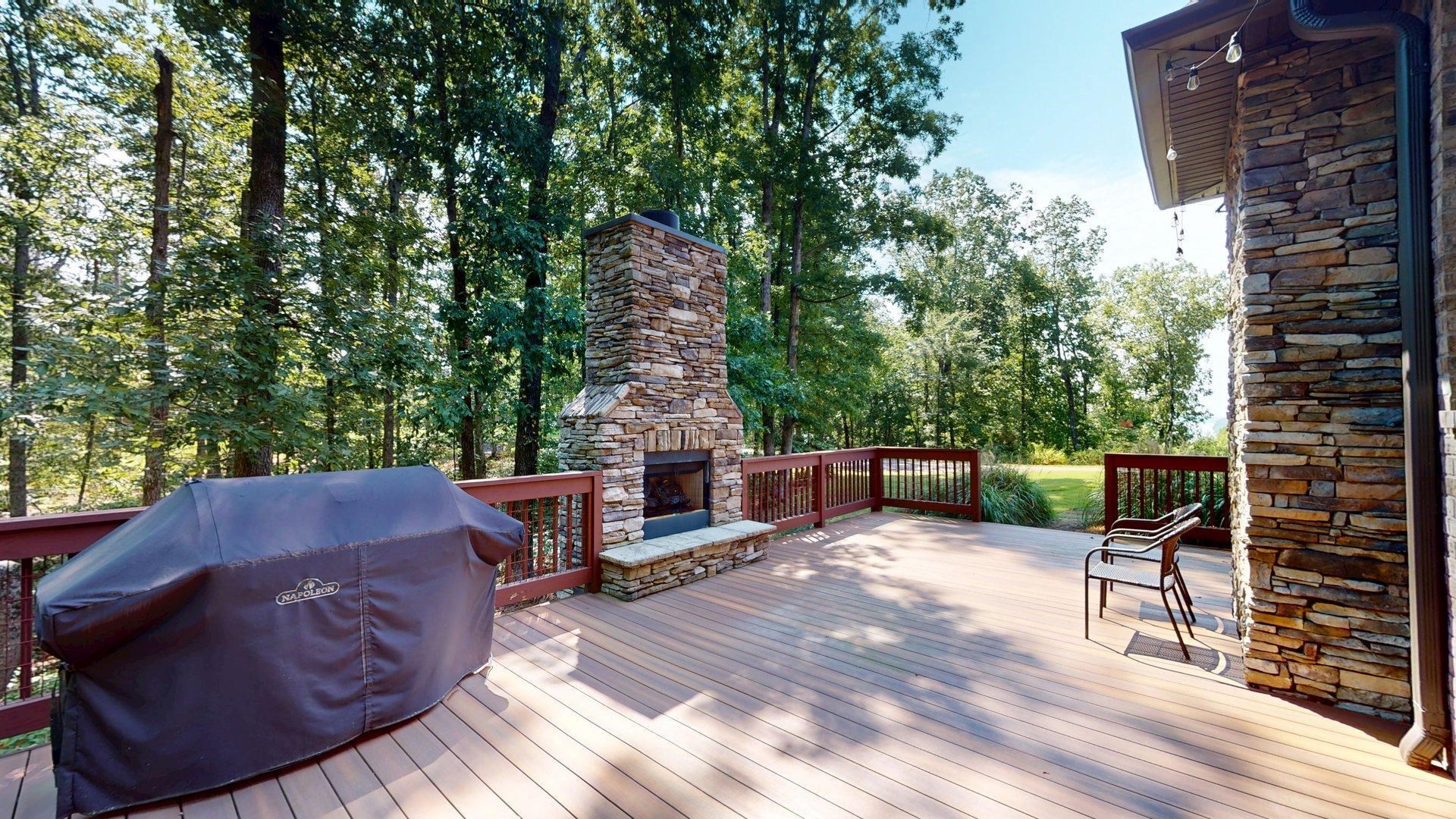 540 Breathtaking Loop Savannah, TN 38372 - Photo 31 of 40 a view of a patio with table and chairs and potted plants with wooden floor and fence
