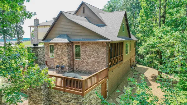a aerial view of a house with outdoor space swimming pool and outdoor seating