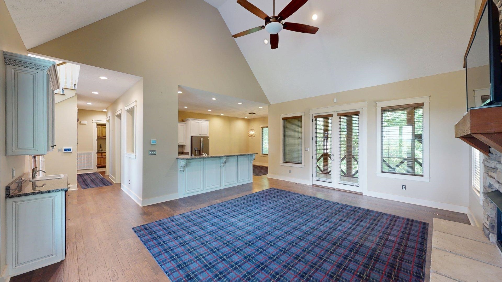 540 Breathtaking Loop Savannah, TN 38372 - Photo 5 of 40 a large bedroom with a large bed a chandelier and windows