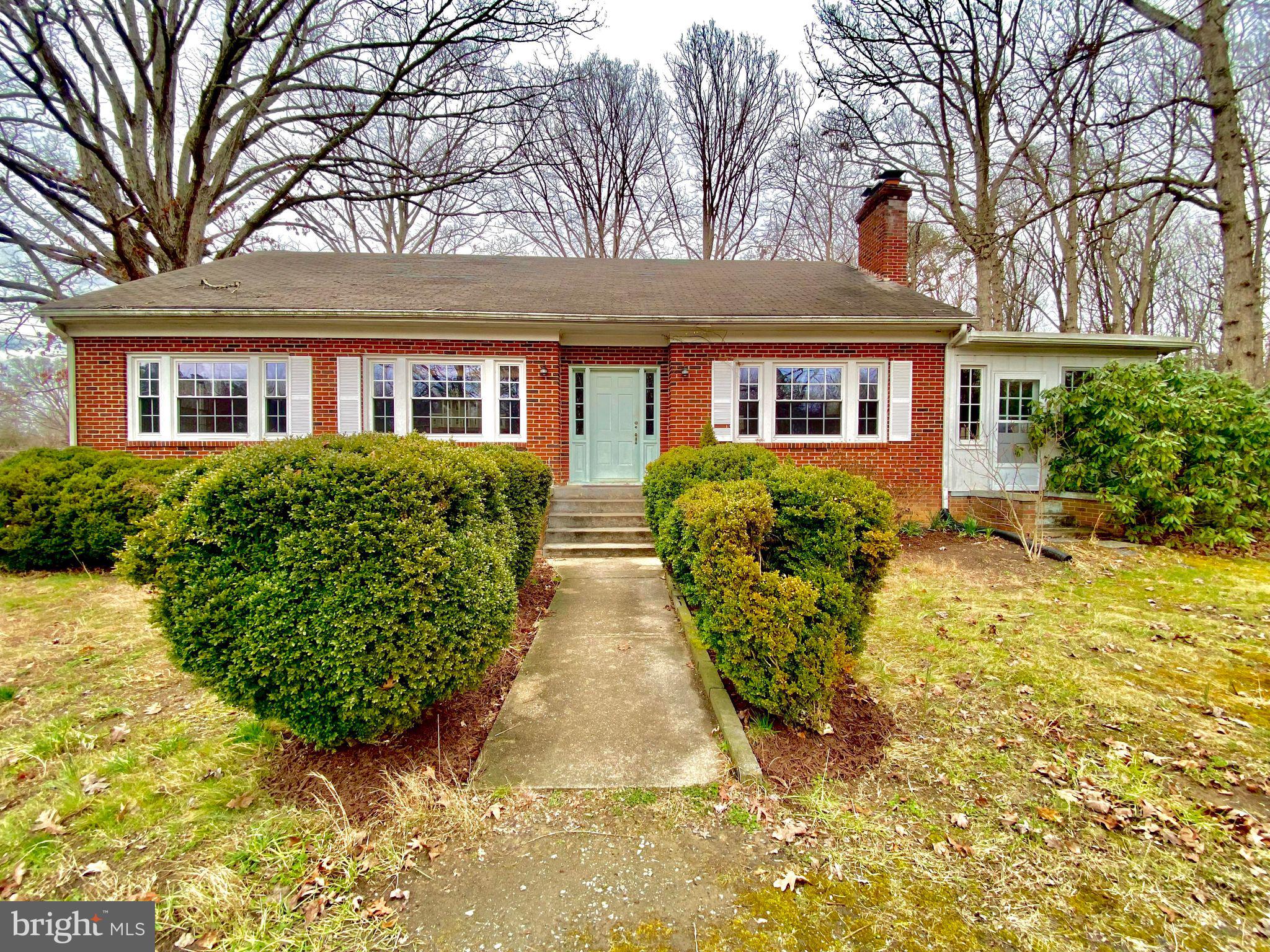 17088 Old Ridge Road Montpelier, VA 23192 - Photo 1 of 38 front view of a house with a garden