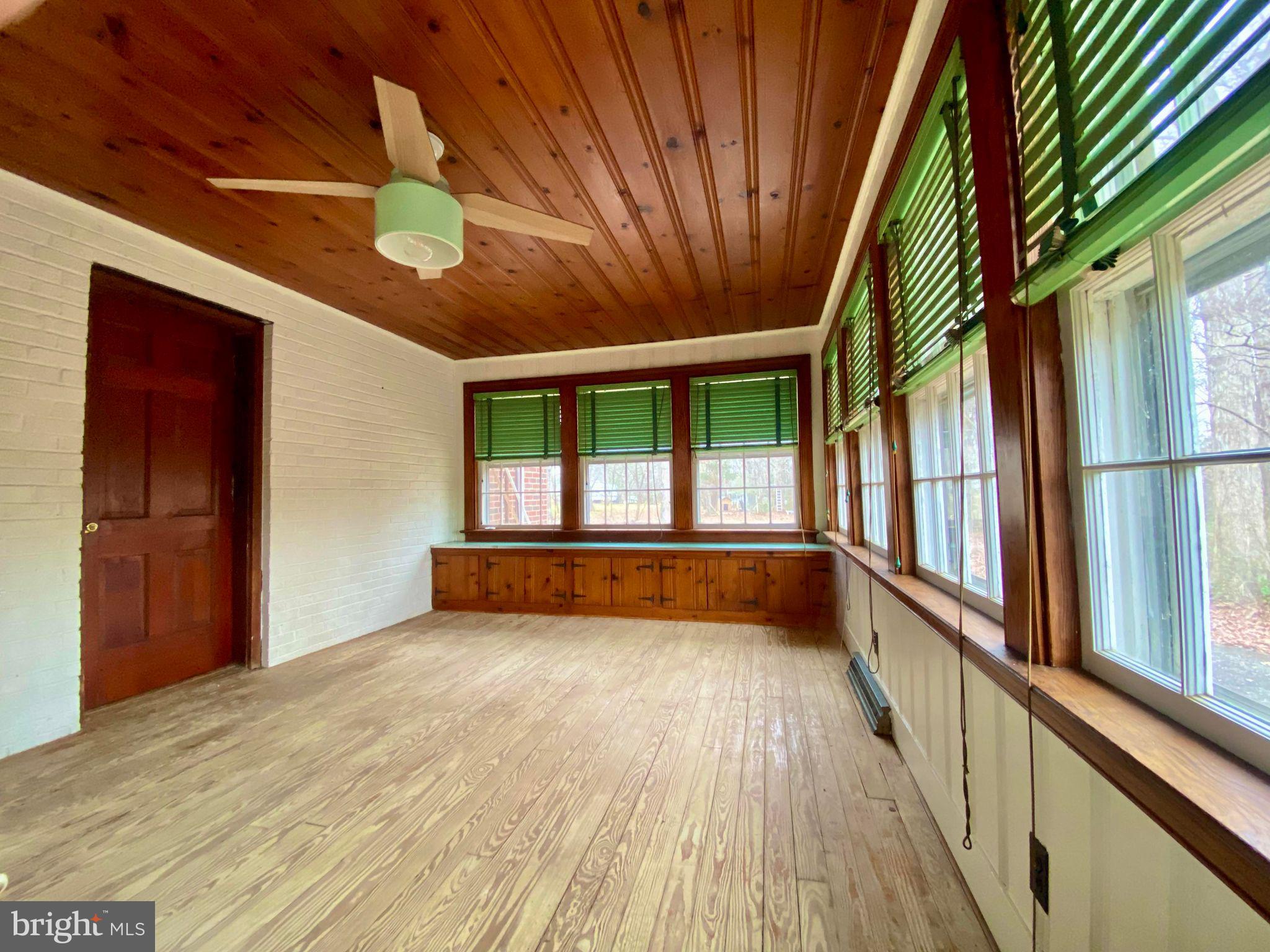 17088 Old Ridge Road Montpelier, VA 23192 - Photo 14 of 38 a view of an empty room with a window and wooden floor
