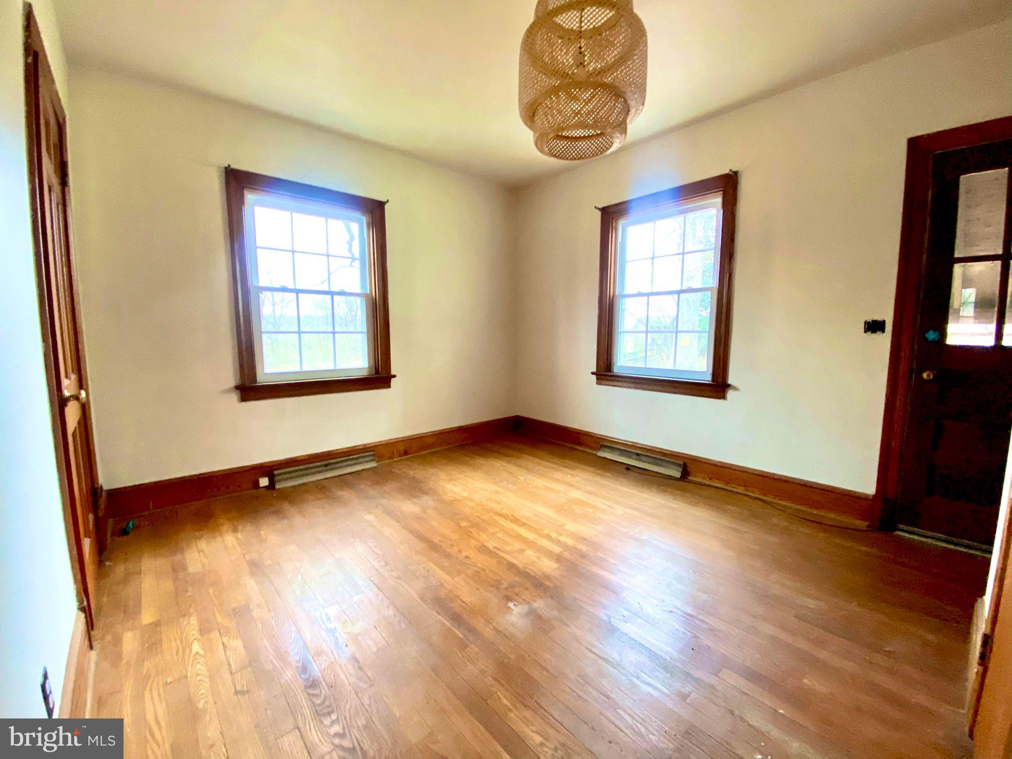 17088 Old Ridge Road Montpelier, VA 23192 - Photo 19 of 38 a view of an empty room with wooden floor and a window